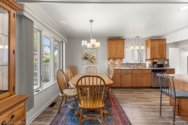 17729 Harman St, Melvindale, MI 48122 - dining area featuring wood finished floors, a chandelier, and recessed lighting