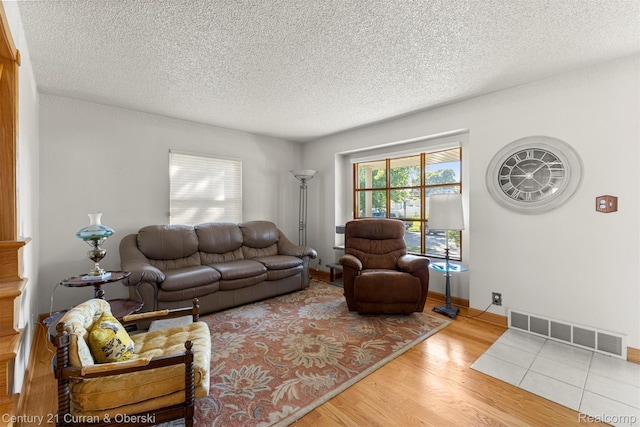 17729 Harman St, Melvindale, MI 48122 - living room with wood finished floors and a textured ceiling