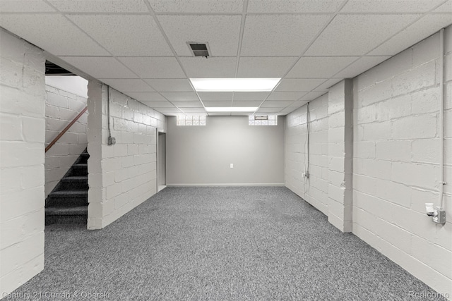 17729 Harman St, Melvindale, MI 48122 - basement featuring carpet floors, a paneled ceiling, and concrete block wall