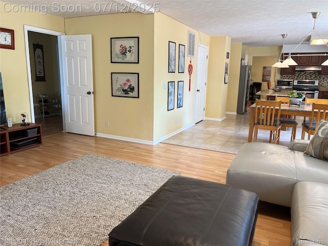 38443 Meghan Ln, Westland, MI 48185 - living room with light wood finished floors