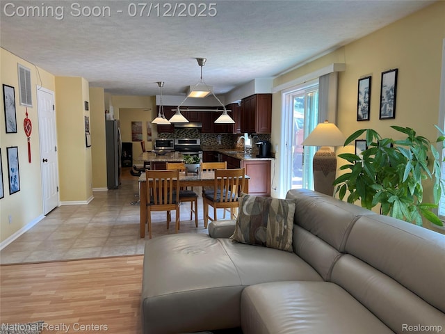 38443 Meghan Ln, Westland, MI 48185 - living room with a textured ceiling
