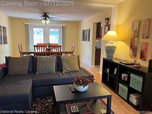 38443 Meghan Ln, Westland, MI 48185 - living room with a ceiling fan, light wood-type flooring, and a textured ceiling