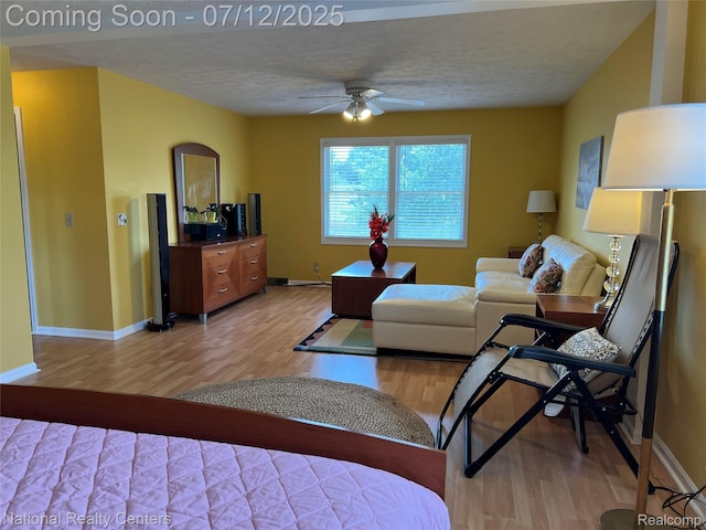 38443 Meghan Ln, Westland, MI 48185 - living area featuring light wood-style flooring, a ceiling fan, and a textured ceiling
