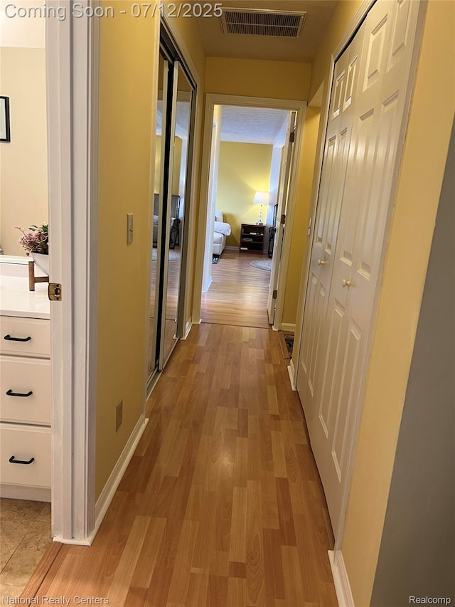 38443 Meghan Ln, Westland, MI 48185 - corridor featuring light wood-style flooring
