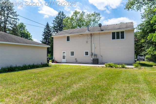 14778 Harrison St, Livonia, MI 48154 - back of house featuring a yard and a patio area