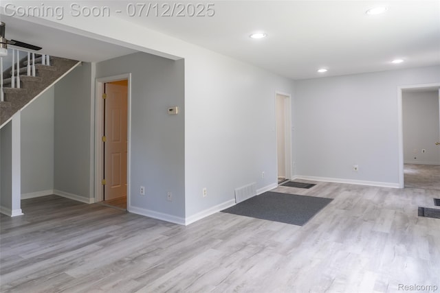 14778 Harrison St, Livonia, MI 48154 - unfurnished living room featuring wood finished floors, recessed lighting, and stairway