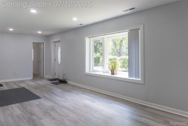 14778 Harrison St, Livonia, MI 48154 - spare room with wood finished floors and recessed lighting