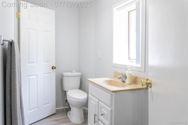 14778 Harrison St, Livonia, MI 48154 - half bathroom featuring vanity and wood finished floors