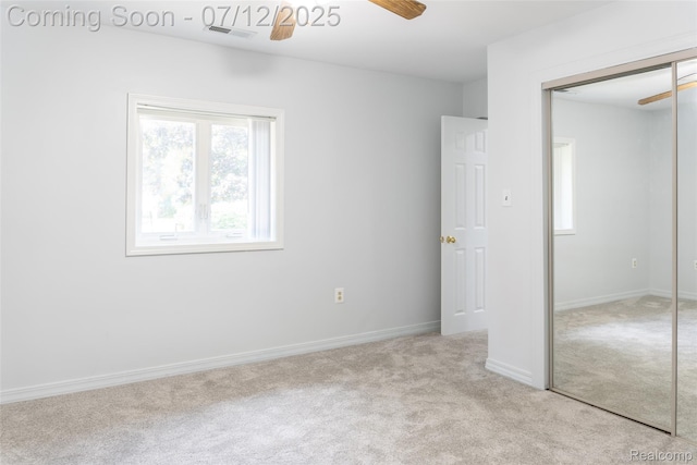 14778 Harrison St, Livonia, MI 48154 - unfurnished bedroom featuring a closet, carpet flooring, and multiple windows