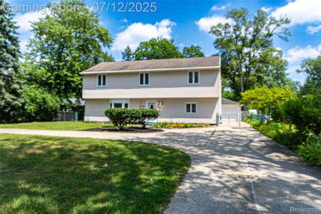 14778 Harrison St, Livonia, MI 48154 - view of front facade with a garage