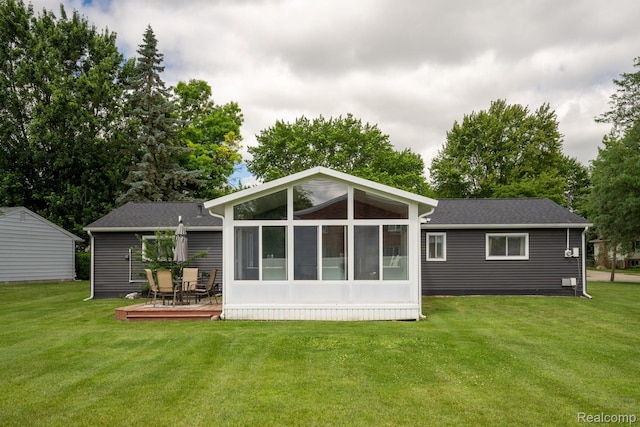 803 S Dayton St, Davison, MI 48423 - back of house with a lawn, a deck, and a sunroom