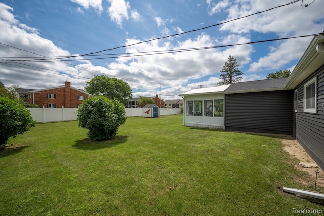 803 S Dayton St, Davison, MI 48423 - view of yard featuring a storage shed and a sunroom