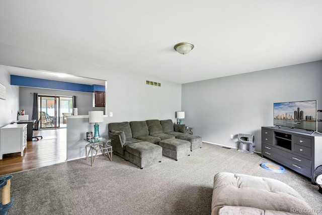803 S Dayton St, Davison, MI 48423 - living room with dark colored carpet and baseboards