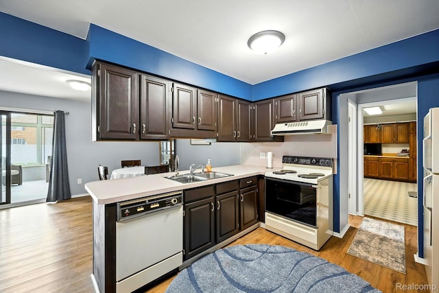 803 S Dayton St, Davison, MI 48423 - kitchen with white appliances, under cabinet range hood, light wood finished floors, and light countertops