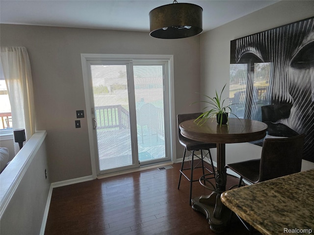 25050 Constitution Ave, Warren, MI 48089 - dining room with baseboards and wood finished floors
