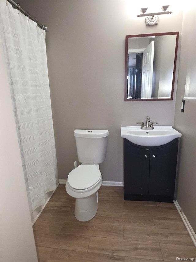 25050 Constitution Ave, Warren, MI 48089 - bathroom with vanity, wood finished floors, and curtained shower