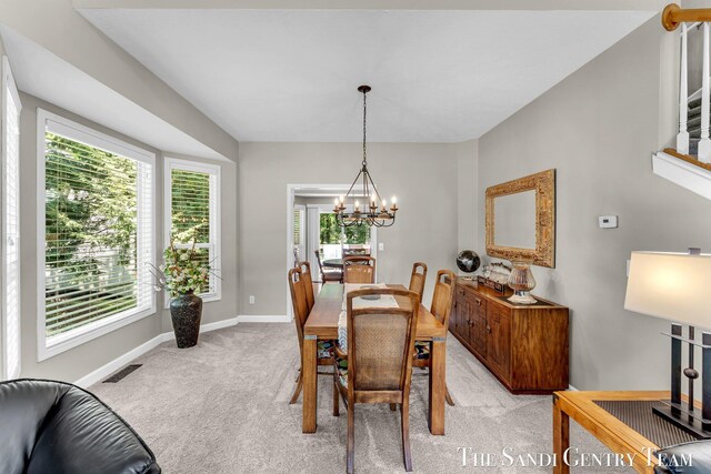 13400 Ravine View Dr, Grand Haven, MI 49417 - dining space featuring a chandelier and light colored carpet