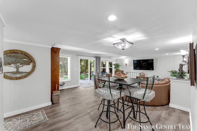 13400 Ravine View Dr, Grand Haven, MI 49417 - dining room featuring wood finished floors, recessed lighting, and ornamental molding