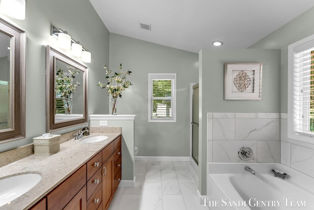 13400 Ravine View Dr, Grand Haven, MI 49417 - full bath with marble finish flooring, double vanity, a bath, a shower with shower door, and vaulted ceiling