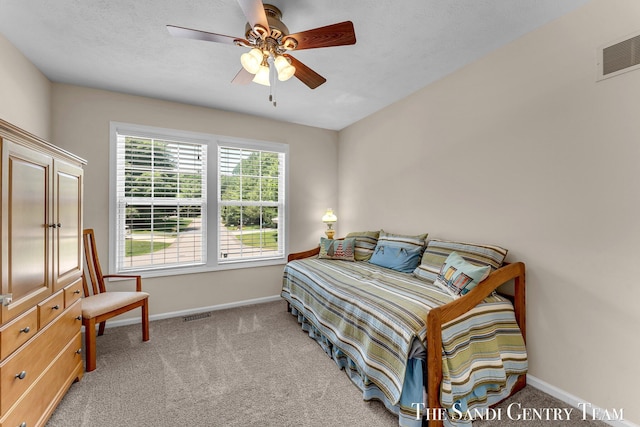 13400 Ravine View Dr, Grand Haven, MI 49417 - bedroom featuring light colored carpet and a ceiling fan