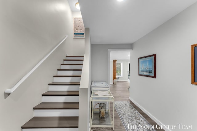 13400 Ravine View Dr, Grand Haven, MI 49417 - stairs featuring wood finished floors and baseboards