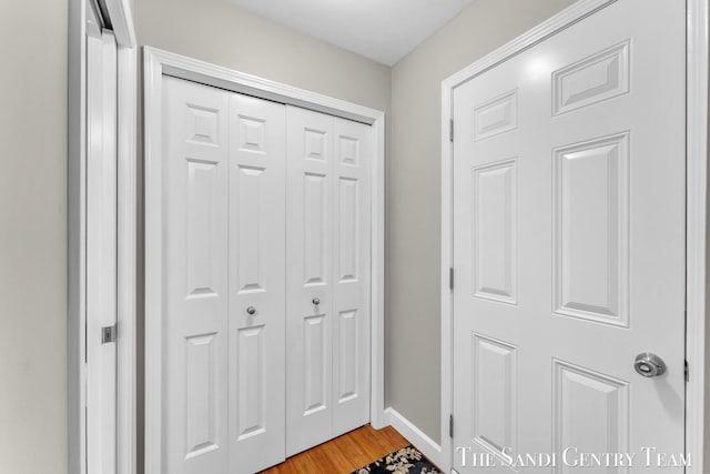 13400 Ravine View Dr, Grand Haven, MI 49417 - doorway to outside featuring light wood-style flooring and baseboards