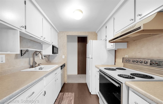 1870 Fort St Unit 1, Trenton, MI 48183 - kitchen with white range with electric cooktop, under cabinet range hood, light countertops, and white cabinetry