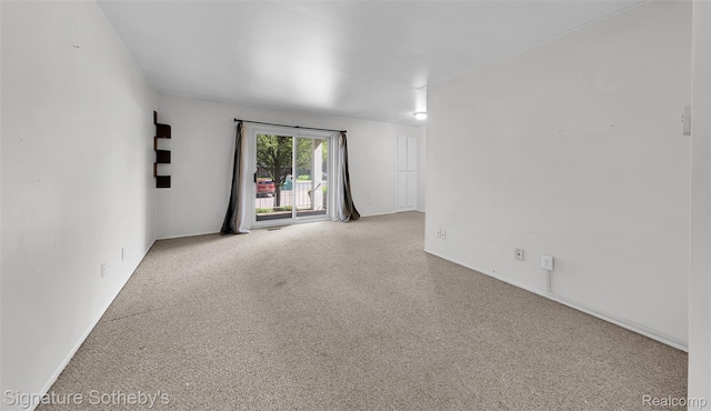 1870 Fort St Unit 1, Trenton, MI 48183 - carpeted empty room featuring baseboards