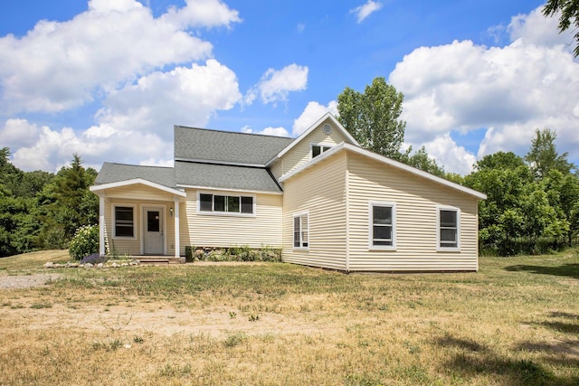 3345 Harmony Rd, Hopkins, MI 49328 - view of front of home with a shingled roof and a front lawn