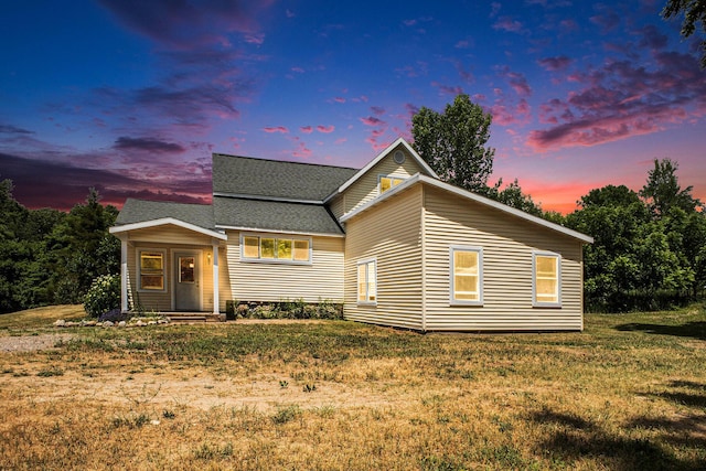 3345 Harmony Rd, Hopkins, MI 49328 - view of front of property with a shingled roof and a lawn