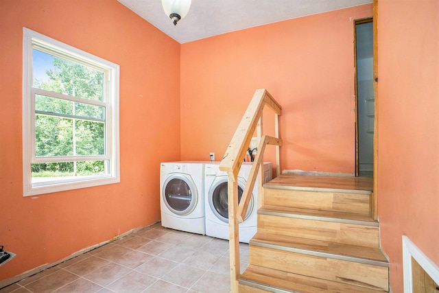 3345 Harmony Rd, Hopkins, MI 49328 - laundry room featuring washer and dryer, plenty of natural light, and tile patterned floors