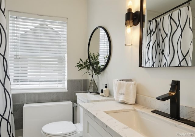 5784 Whittier St, Detroit, MI 48224 - bathroom with healthy amount of natural light, vanity, and curtained shower