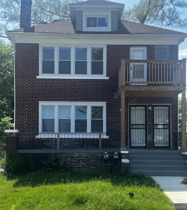 14557 Strathmoor St, Detroit, MI 48227 - bungalow-style home featuring a balcony, brick siding, and a chimney