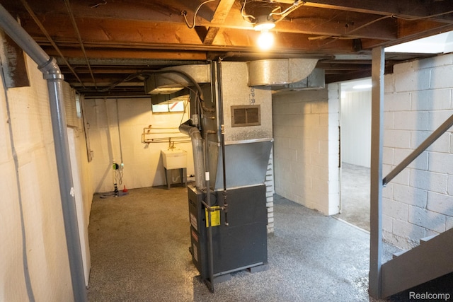 4410 Brunswick Ave, Flint, MI 48507 - unfinished basement with a sink and heating unit