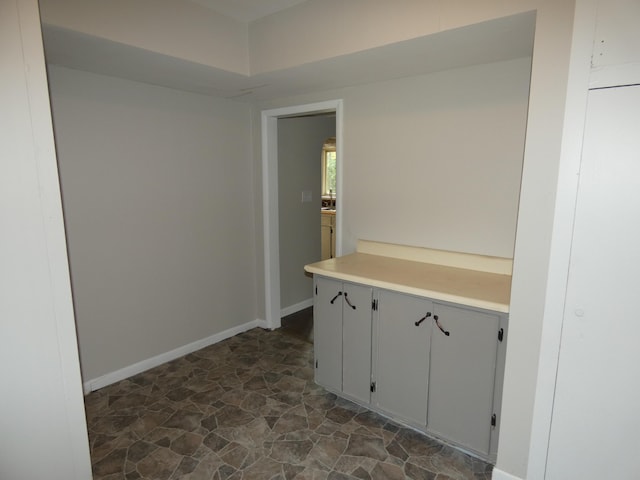1634 Ogden Ave, Benton Harbor, MI 49022 - corridor featuring dark stone finish floors and baseboards