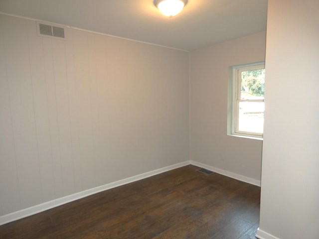 1634 Ogden Ave, Benton Harbor, MI 49022 - empty room featuring dark wood-type flooring and baseboards