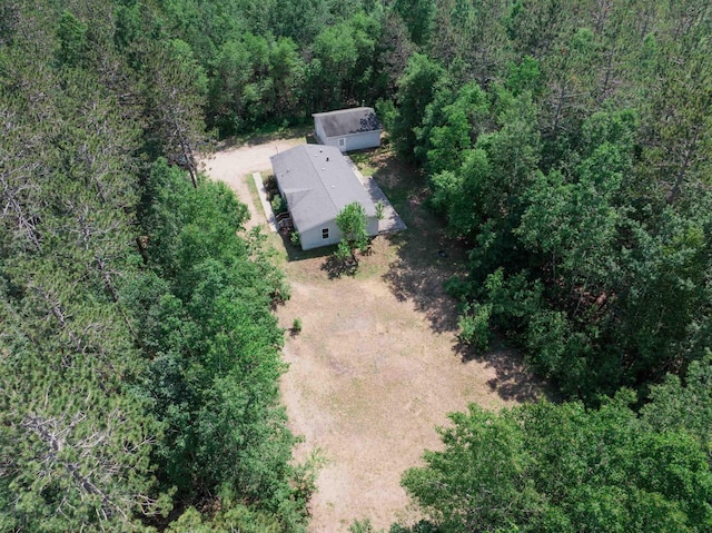 1134 Wagon Wheel Ln, Interlochen, MI 49643 - view of subject property with a heavily wooded area