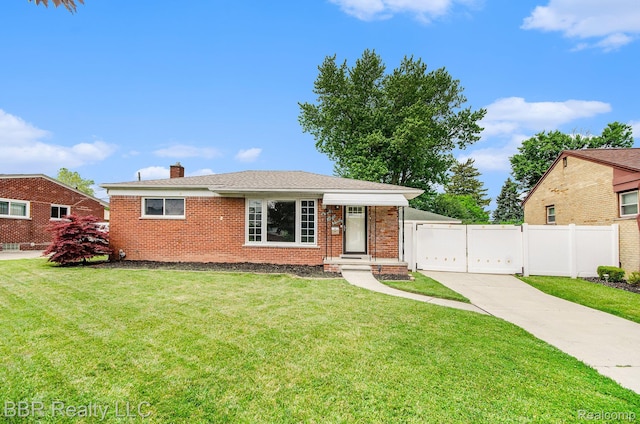 2890 Maxwell St, Trenton, MI 48183 - view of front of house featuring a chimney, brick siding, and a gate