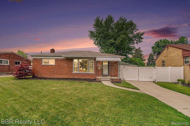 2890 Maxwell St, Trenton, MI 48183 - view of front of home with brick siding and a chimney