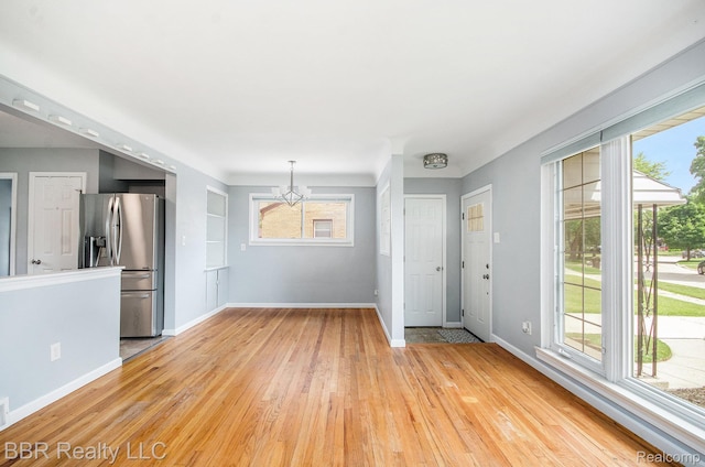 2890 Maxwell St, Trenton, MI 48183 - interior space featuring a chandelier, light wood-type flooring, and healthy amount of natural light