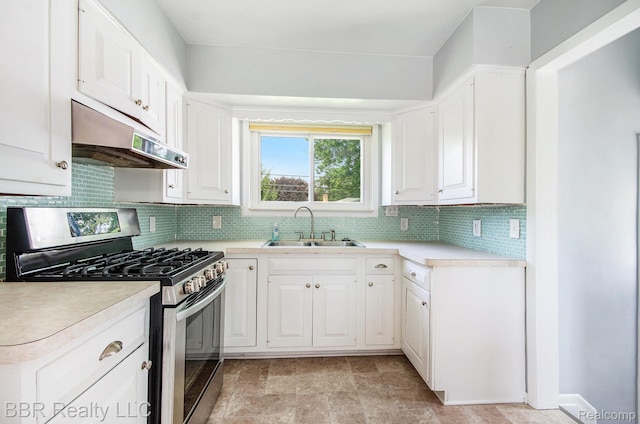 2890 Maxwell St, Trenton, MI 48183 - kitchen featuring stainless steel range with gas stovetop, under cabinet range hood, decorative backsplash, and light countertops