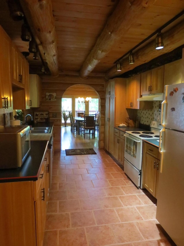 6325 Big Bay Rd, Bear Lake, MI 49614 - kitchen with white appliances, arched walkways, dark countertops, a wood ceiling with exposed beams, and rail lighting