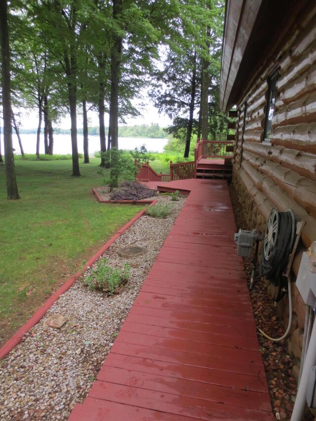 6325 Big Bay Rd, Bear Lake, MI 49614 - deck with a water view and a lawn