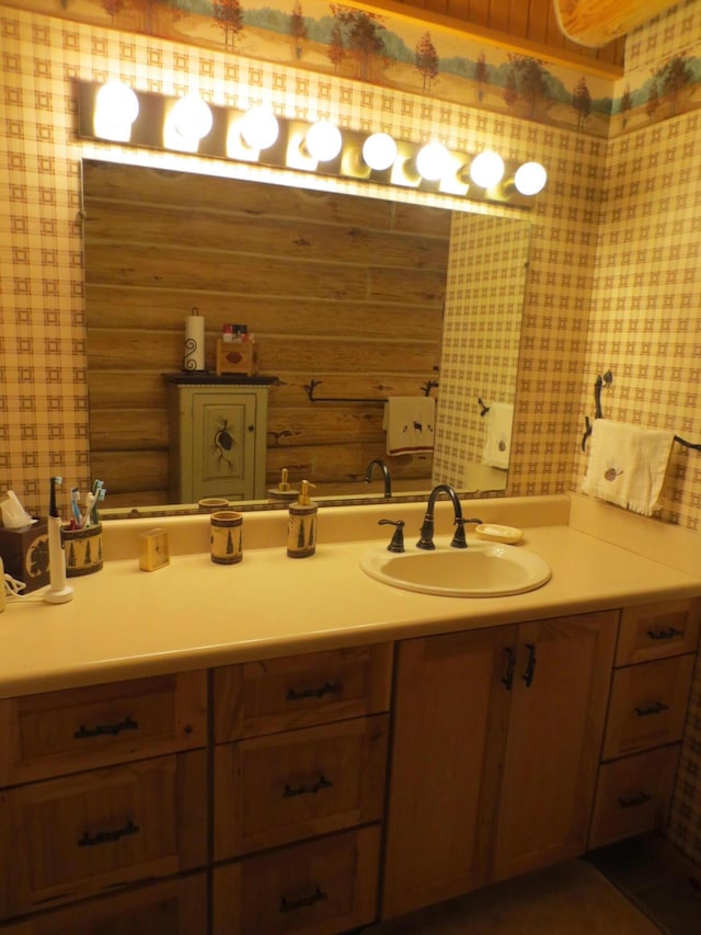 6325 Big Bay Rd, Bear Lake, MI 49614 - bathroom featuring wallpapered walls and vanity
