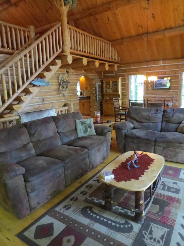 6325 Big Bay Rd, Bear Lake, MI 49614 - living area featuring log walls, a wooden ceiling with exposed beams, stairway, and high vaulted ceiling