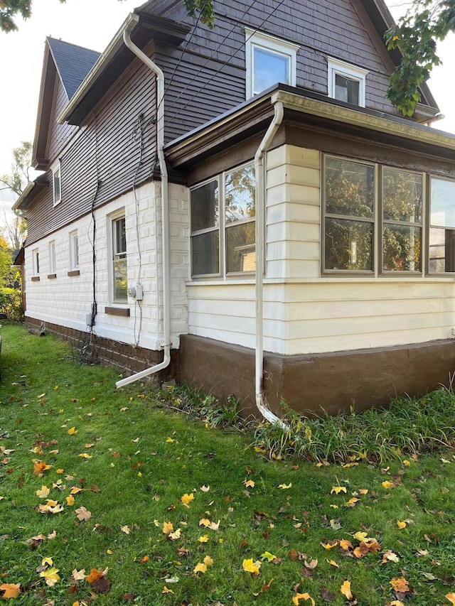 611 Steward Ave, Jackson, MI 49202 - view of home's exterior with a lawn
