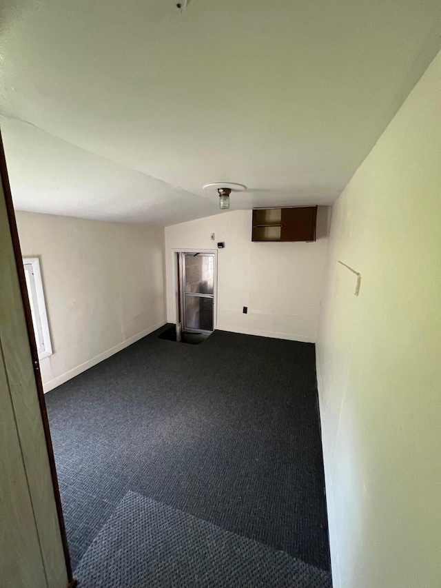 611 Steward Ave, Jackson, MI 49202 - spare room featuring dark carpet