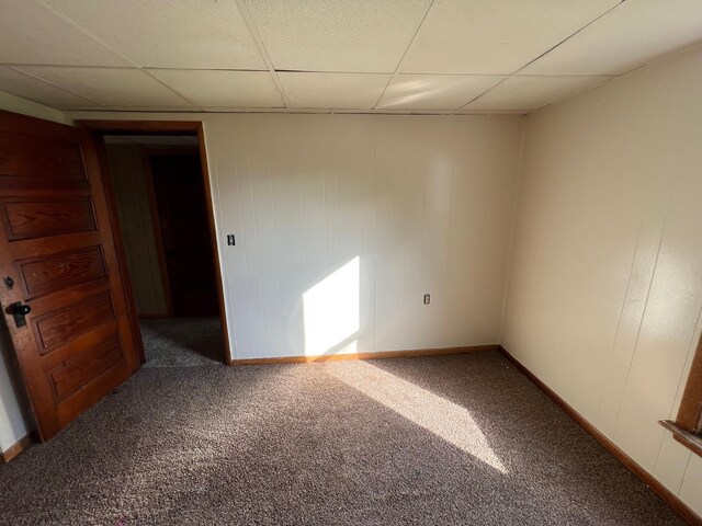 611 Steward Ave, Jackson, MI 49202 - carpeted spare room featuring a drop ceiling and baseboards