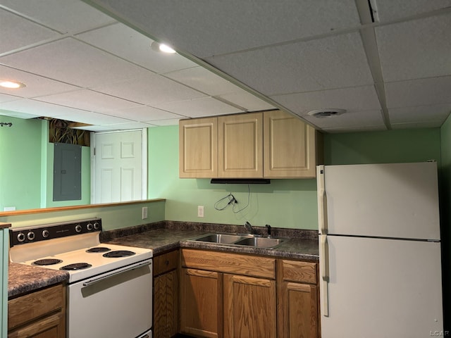 6143 Shepherd Rd, Adrian, MI 49221 - kitchen featuring white appliances, electric panel, a paneled ceiling, and dark countertops