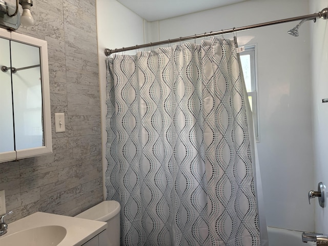 6143 Shepherd Rd, Adrian, MI 49221 - full bath with tile walls, vanity, and shower / tub combo with curtain